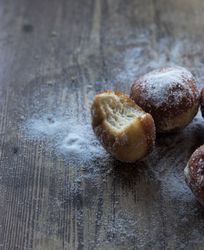 Baked cakes in craft paper on table