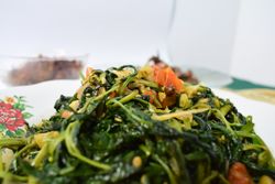 Plate of healthy cooked vegetable side dish on table
