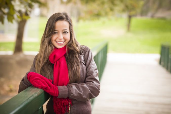 Female Portrait Wearing Red Scarf and Mittens Outside
