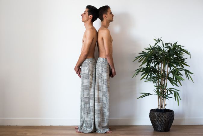 Stylish shirtless gay couple posing