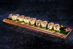 Delicious fried sushi with cream on tray
