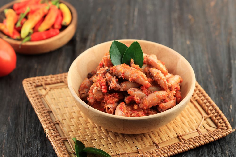 Sambel Cumi, Stir Frry Spicy Salted Squid on Wooden Bowl.