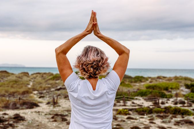 Adult woman practicing martial arts in nature