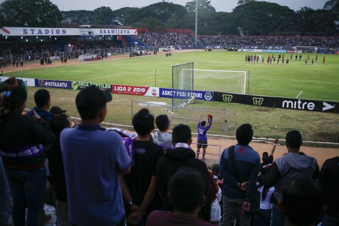 Kedira, East Java Indonesia - October 4, 2019: Looking down at the soccer field from the stands