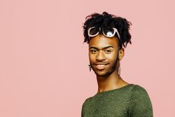 Colorful studio portrait of a young man smiling