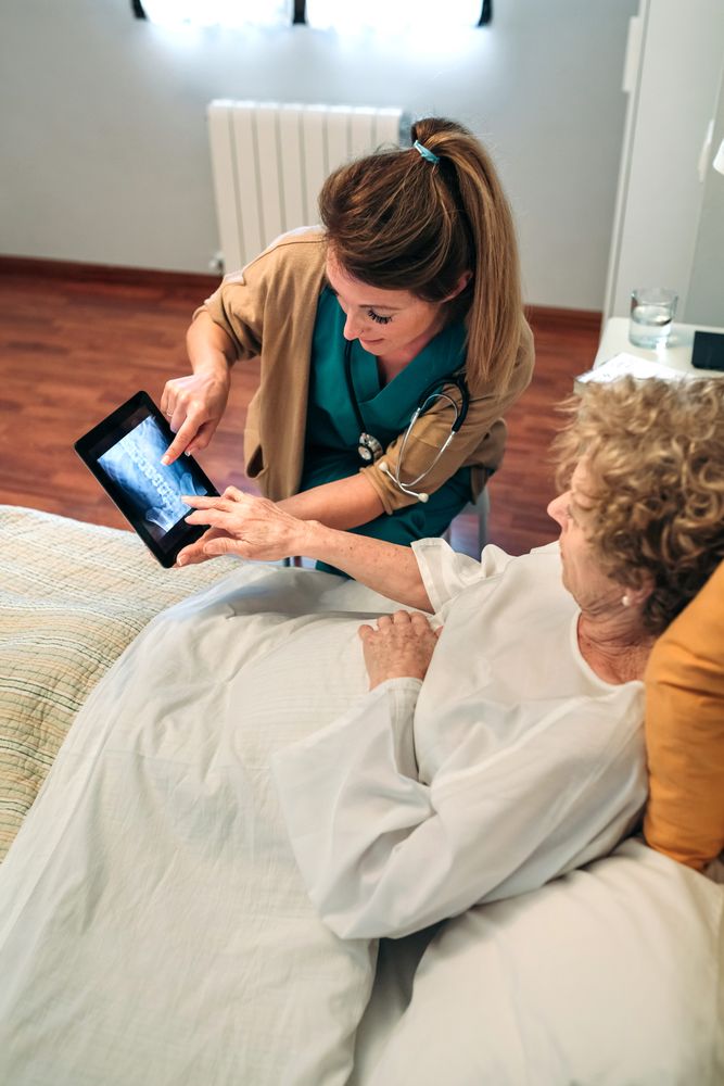 Female doctor showing an x-ray on the tablet