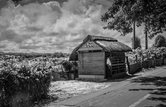 Monochrome shot of old taxi stand on roadside in Mauritius