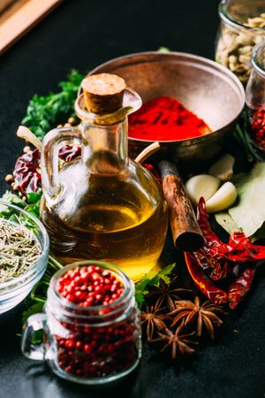 Spices and oil on table