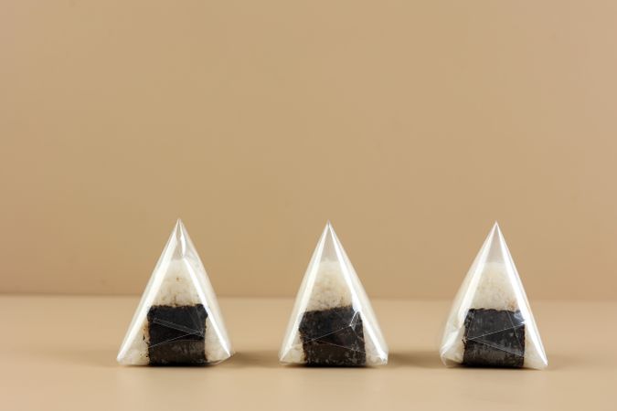 Three Japanese Onigiri Wrapped with Plastic,