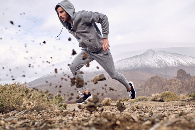 man running fast in mountains