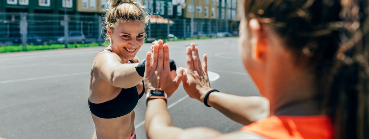 Sportswoman training boxing with her trainer