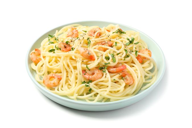 Plate with tasty pasta isolated on plain background
