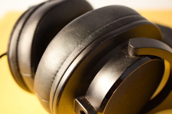Close up of headphone cushion on yellow background