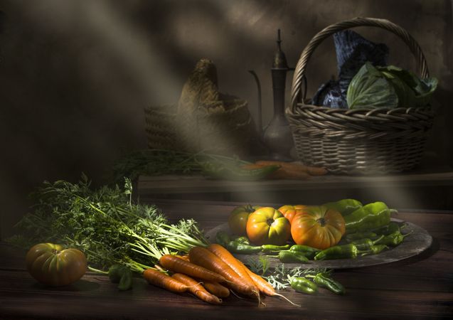 Vegetable still life in sunlight on wooden table