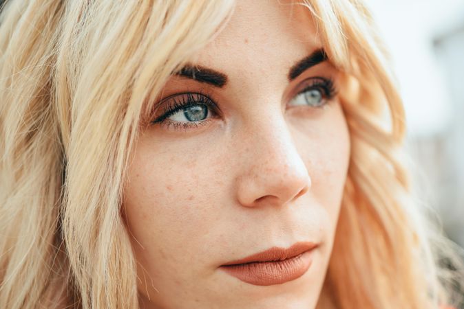 Portrait of blonde female with beautiful blue eyes