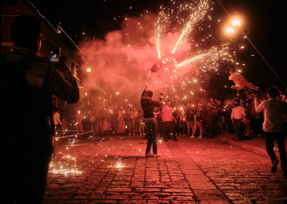 Man doing fireworks display during parade at night