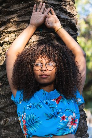 Trendy woman near palm