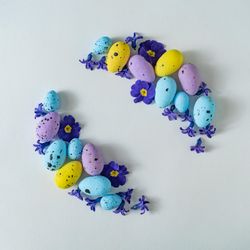 Easter eggs and purple flowers and leaves