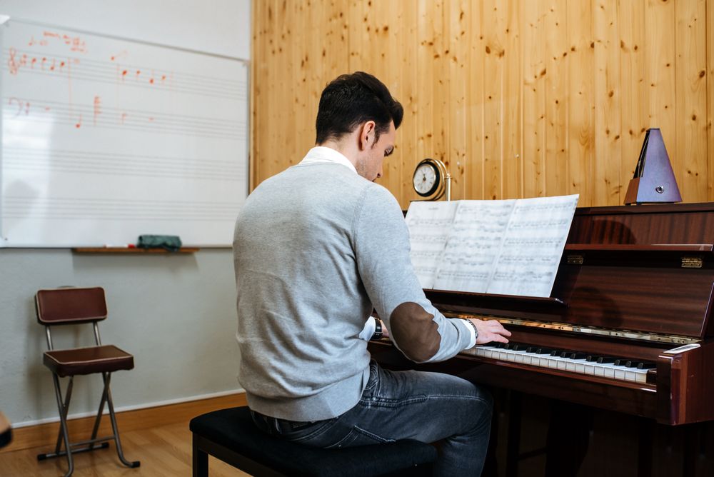 Man playing piano in studio