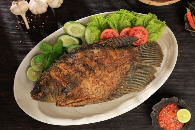 Ikan Gurame Goreng, Deep Fried Gourami Served with Indonesian Sambal Spicy Sauce and Lettuce and Tomato