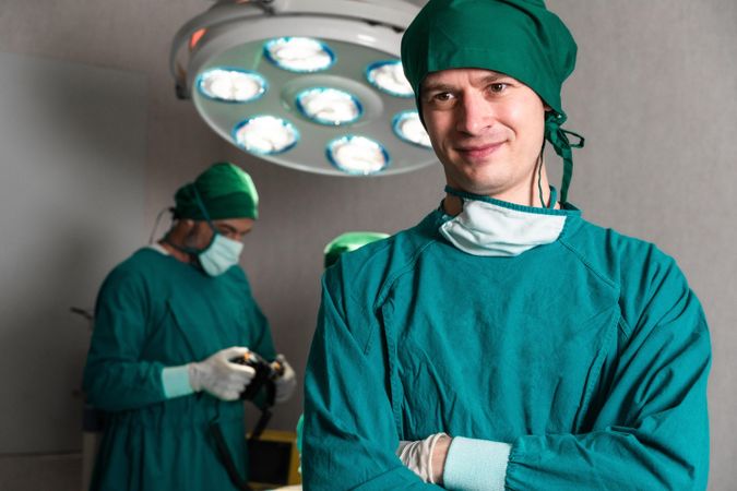 Male surgeon in operating theater wearing scrubs