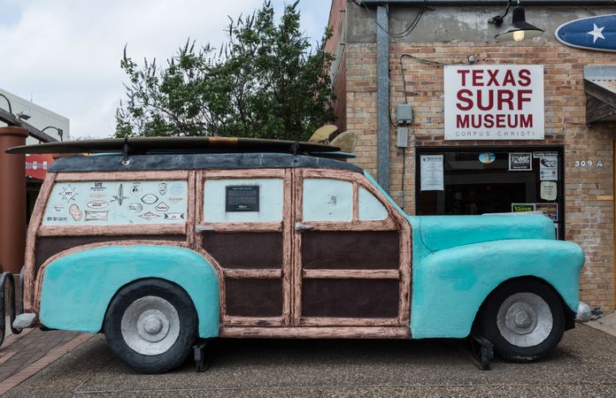 A classic “woodie” station wagon, stands outside the Texas Surf Museum in Corpus Christi, Texas