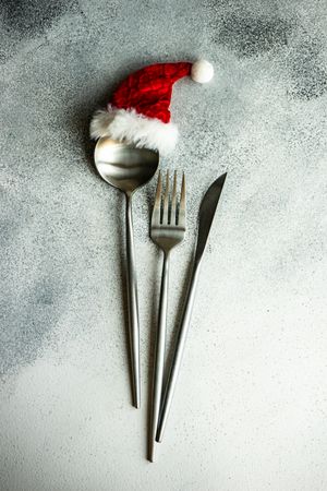 Christmas table setting with small Santa hat on spoon
