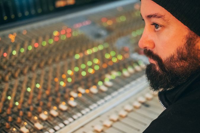 Man in a equalizer instrument in a studio