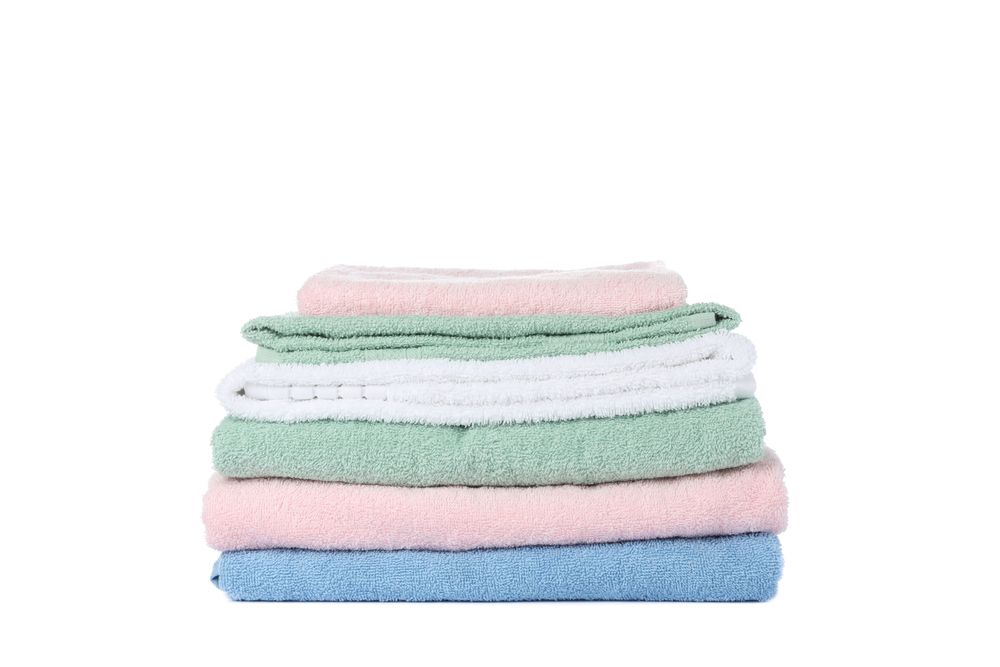 Folded color towels isolated on blank background