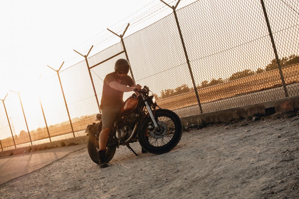Strong man driving motorcycle