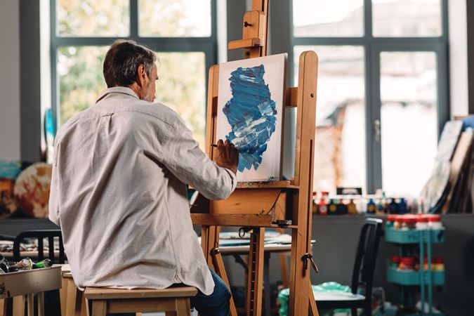 Shot of male painter at work in studio