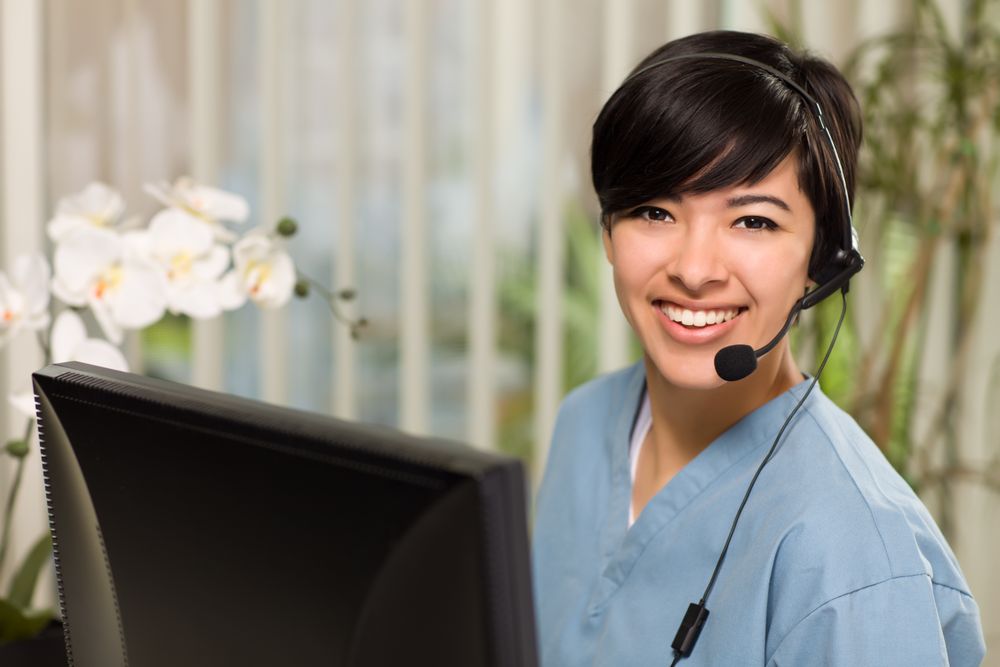 Young Woman Wearing Headset and Scrubs