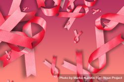 Scattered pink ribbons on pink background 56Q2N0