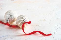 Snowy decor of baubles and red ribbon