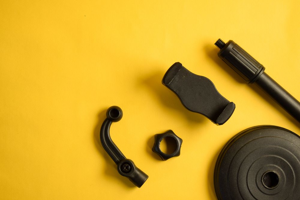 Phone accessories for stand on yellow background, with copy space