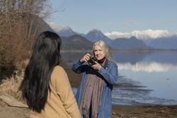 Woman photographing another female