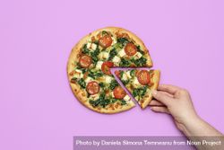 Woman hand taking a slice of pizza 5lnmab