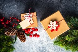 Top view of two Christmas presents wrapped with decorative snowflakes