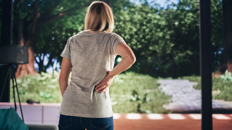 Human Going Through Severe Back Pain.