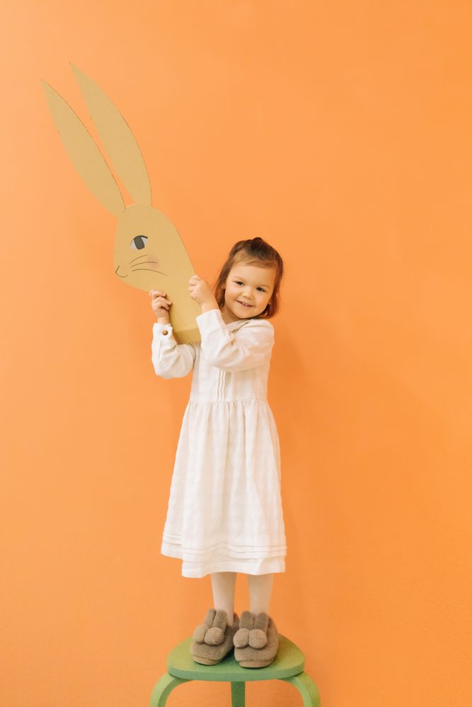 Little girl with paper bunny