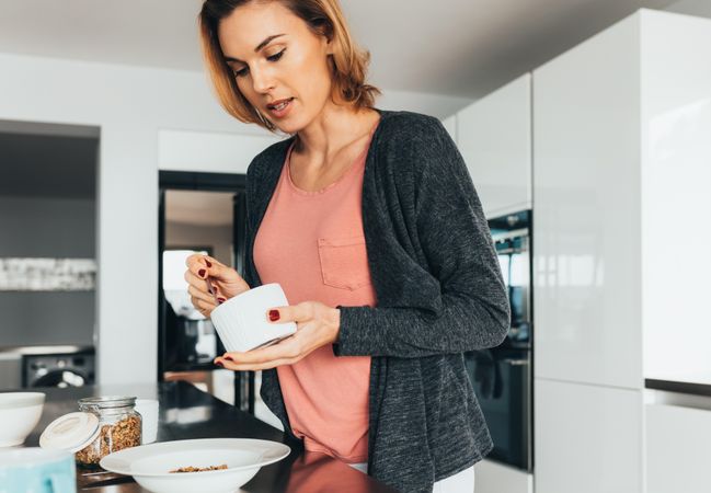 Woman preparing a healthy breakfast cereal