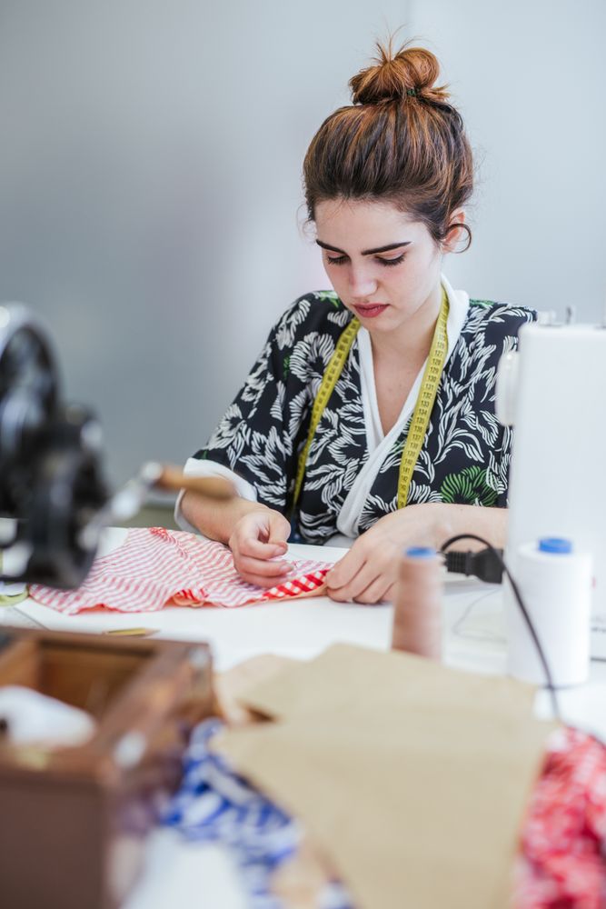 Woman in a sewing school