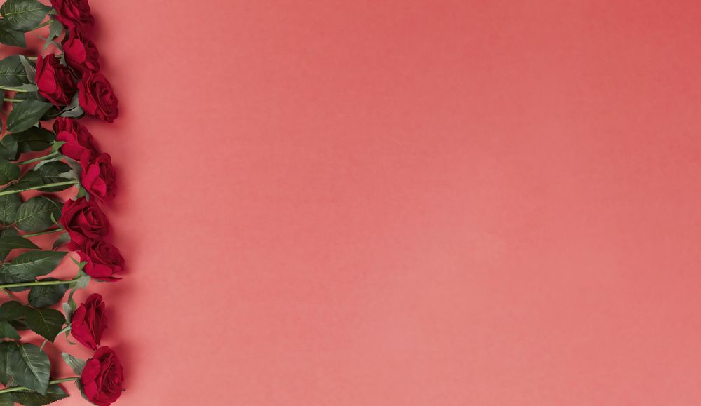 Valentine’s day celebration with red roses on a soft red setting