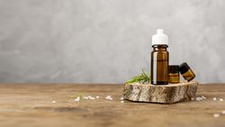 Arrangement with essential oils on wooden table