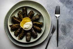 Top view of grey plate with traditional Georgian dolma snack