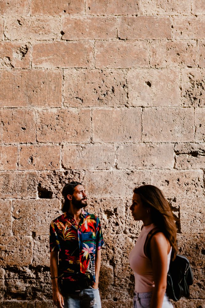 Couple in old town exploring architecture