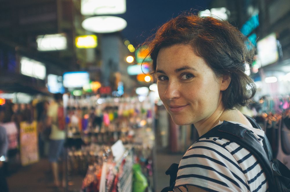 Female traveler in souvenir shop