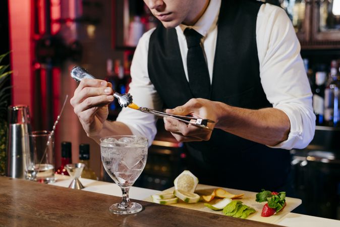 Barman working making drinks