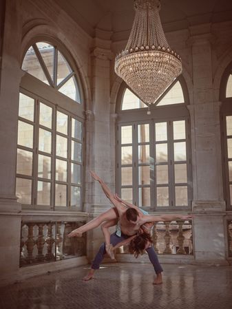 Bended dancer with ballerina on back in palace