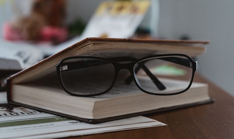 Frame eyeglasses in a slightly open book